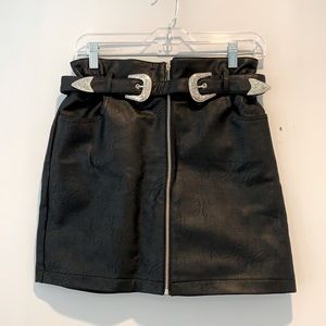 Black leather skirt with silver buckle belt.